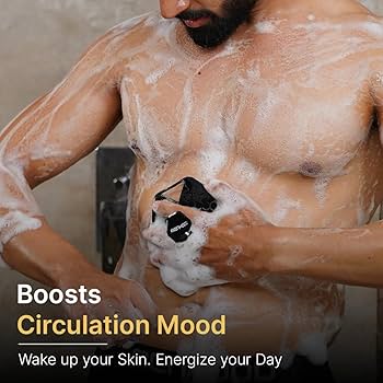 Man using GRIT silicone scrubber, lathered up in the shower